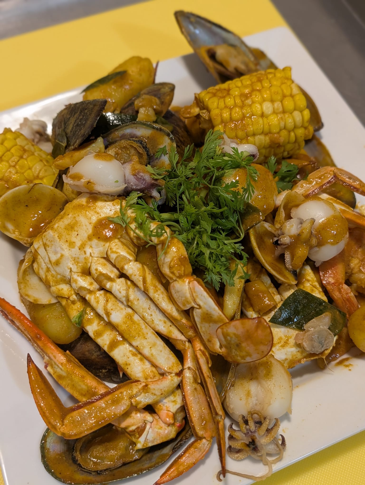 Thai Seafood Feast in Oshawa — grilled squid, mussels, shrimp, clams with curry sauce